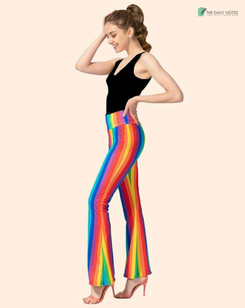 A Black Tank Top With Rainbow Colored Flared Pants